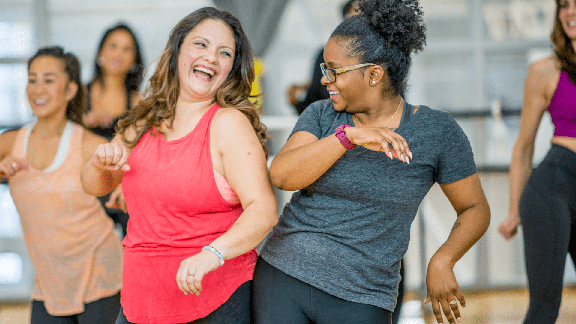 A group of women having a good time exercising.